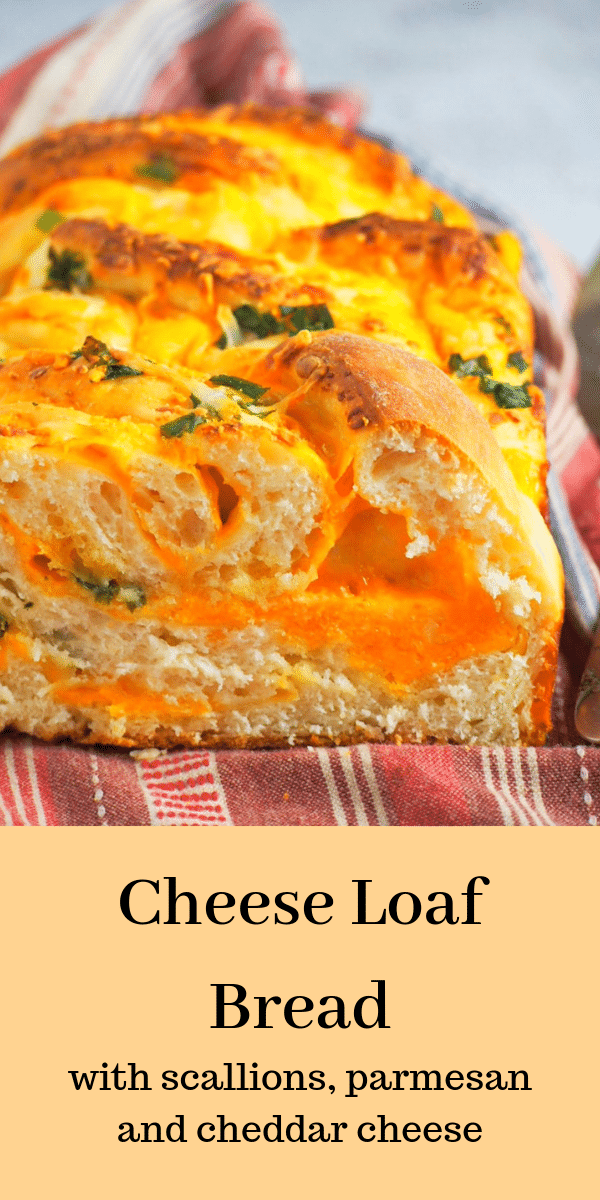 Cheddar and parmesan cheeses with bits of scallions, this savory cheese loaf bread will have you wanting slices after slices. It is ultimately cheesy! #cheesebread #cheeseloaf #cheddarbread