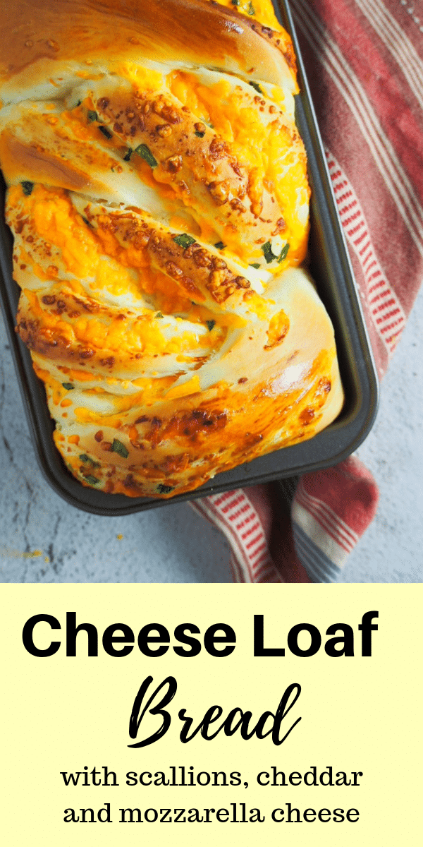 Cheddar and parmesan cheeses with bits of scallions, this savory cheese loaf bread will have you wanting slices after slices. It is ultimately cheesy! #cheesebread #cheeseloaf #cheddarbread