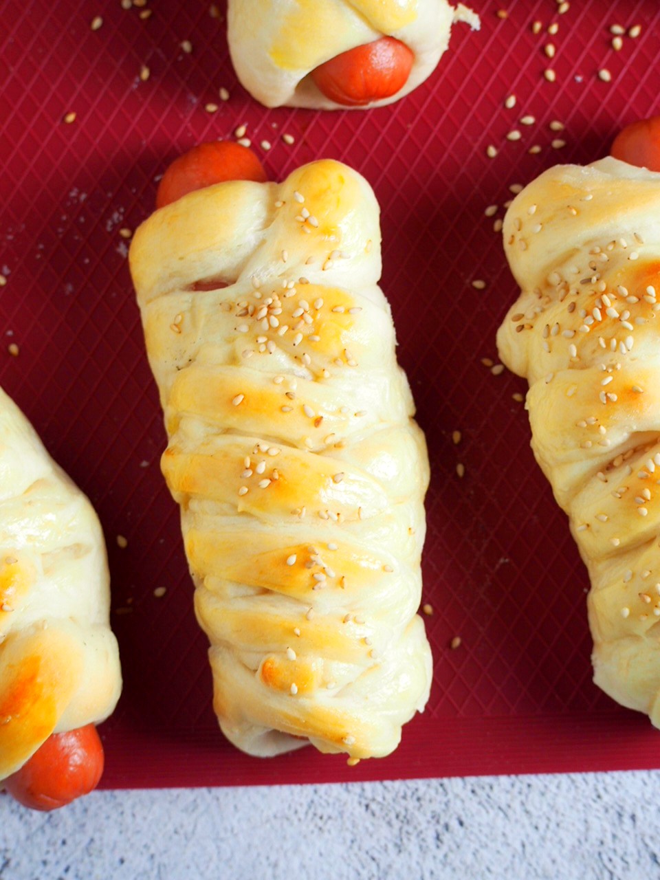Top angle shot of braided hotdog buns.