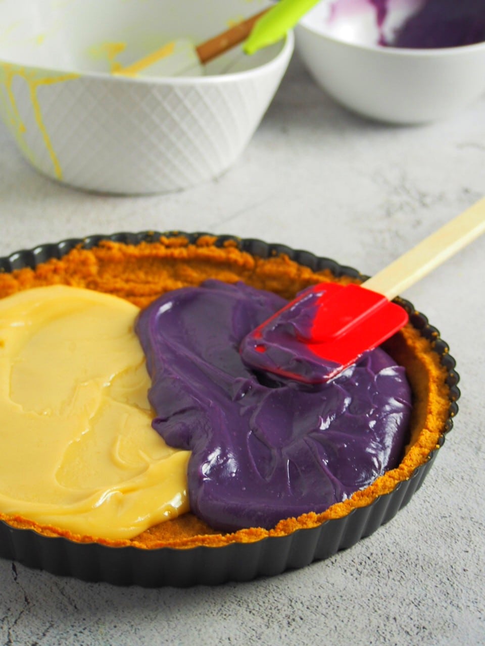 The milk and ube custard poured into the tart shell.