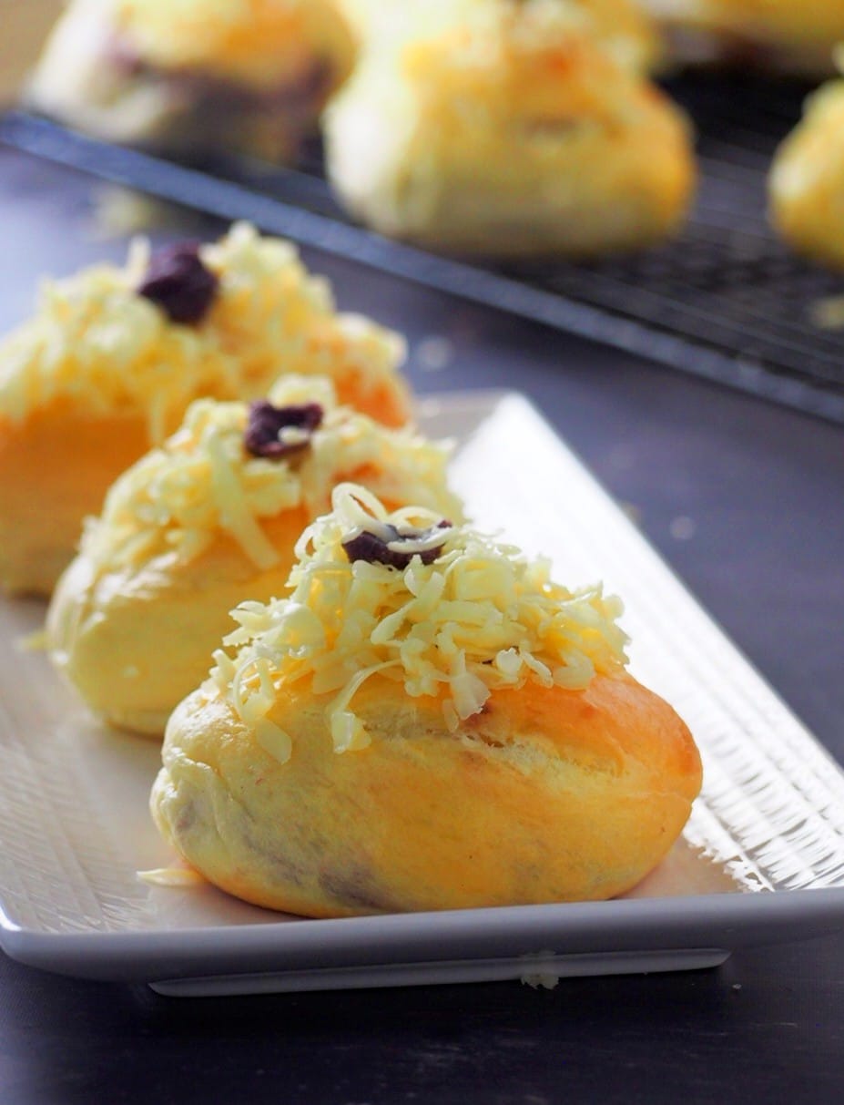 Ube ensaymada on a serving plate.