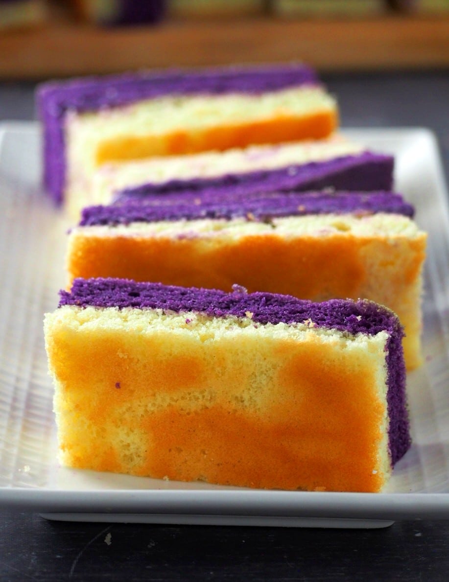Slices of ube and vanilla chiffon on a serving plate.