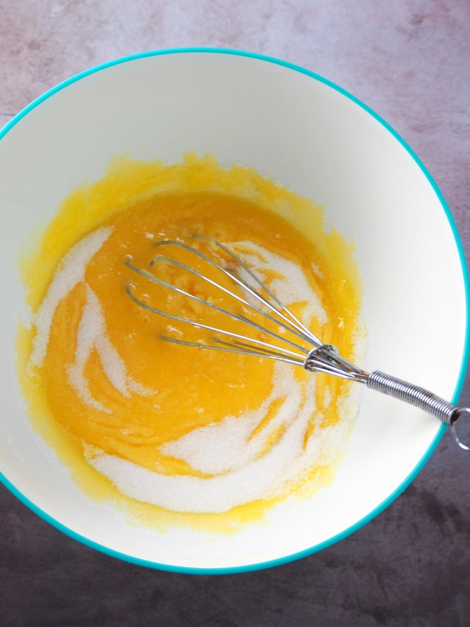 Mixing the egg yolks and sugar to make the batter for Taisan.