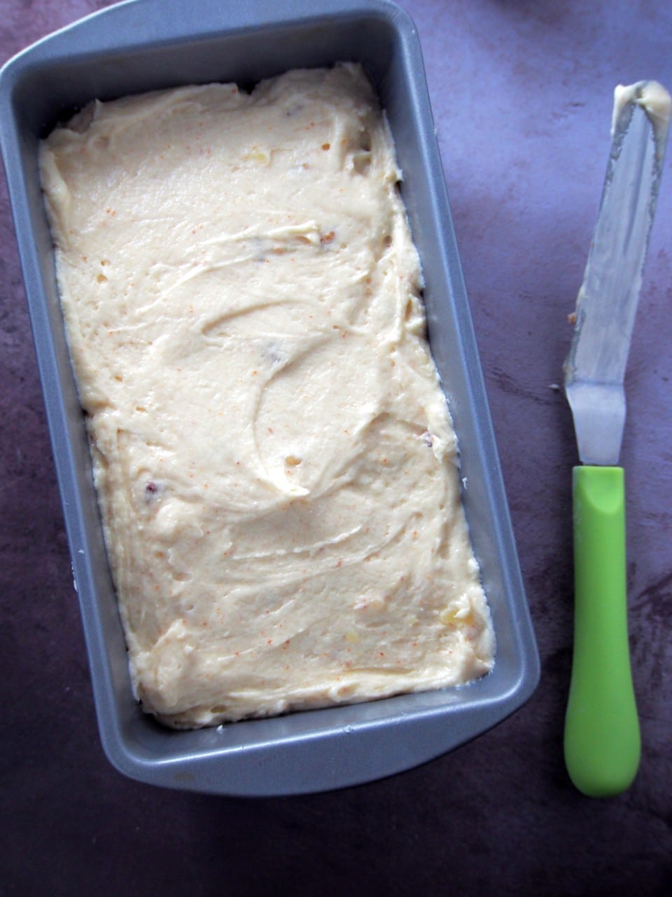 Brown butter pound cake batter on a baking pan.