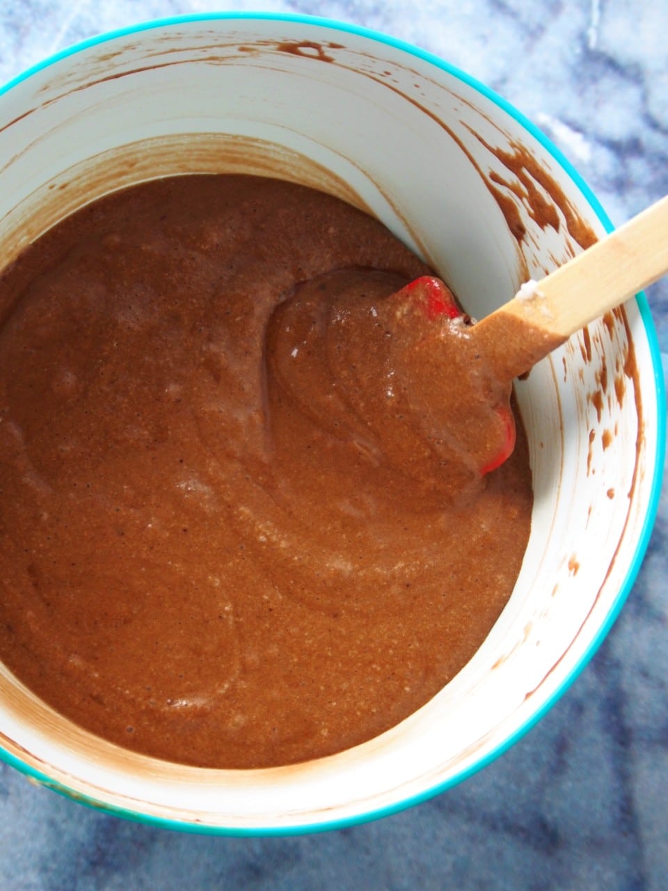 Mixing the batter of chocolate mamon on a mixing bowl.