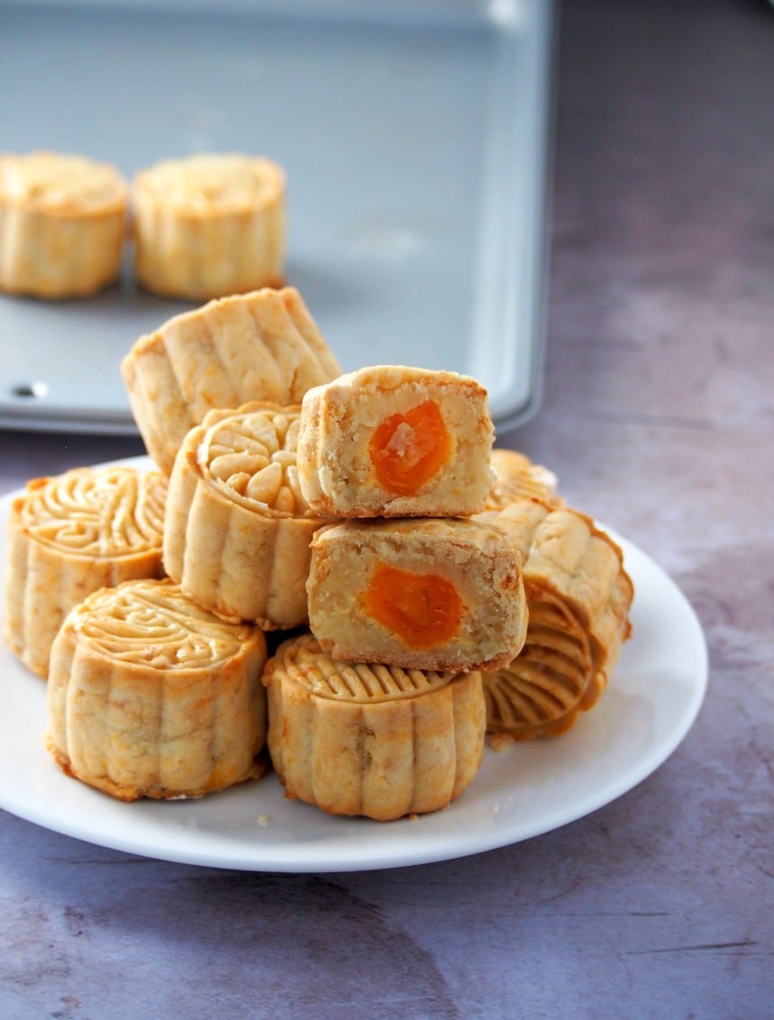 Moon Cake photo showing a sliced piece to expose the fillings inside.