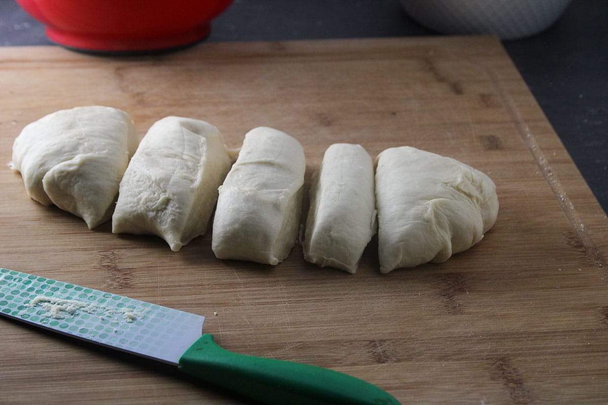 Dividing the bread dough into 5 portions.