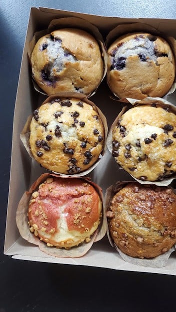 A box of assorted muffins.