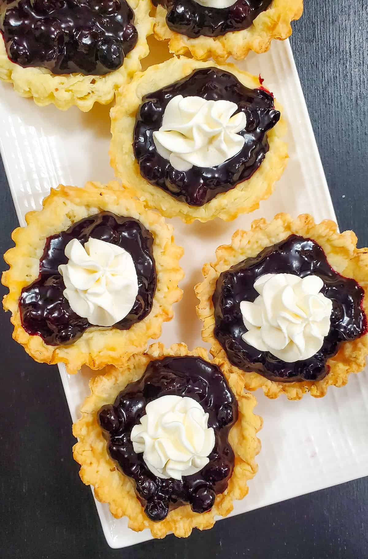 Blueberry Puff pastry tartlet on a platter.