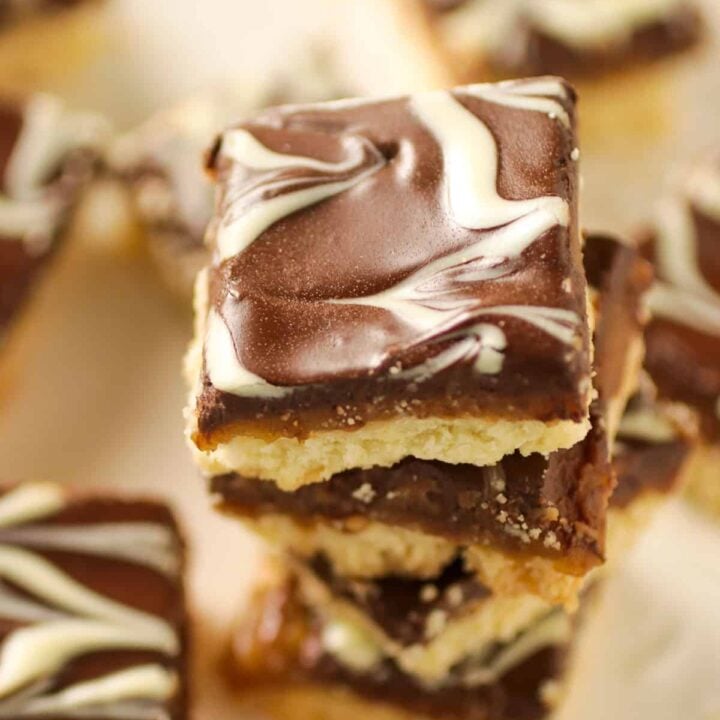 Marbled shortbread cookies stacked on a platter.
