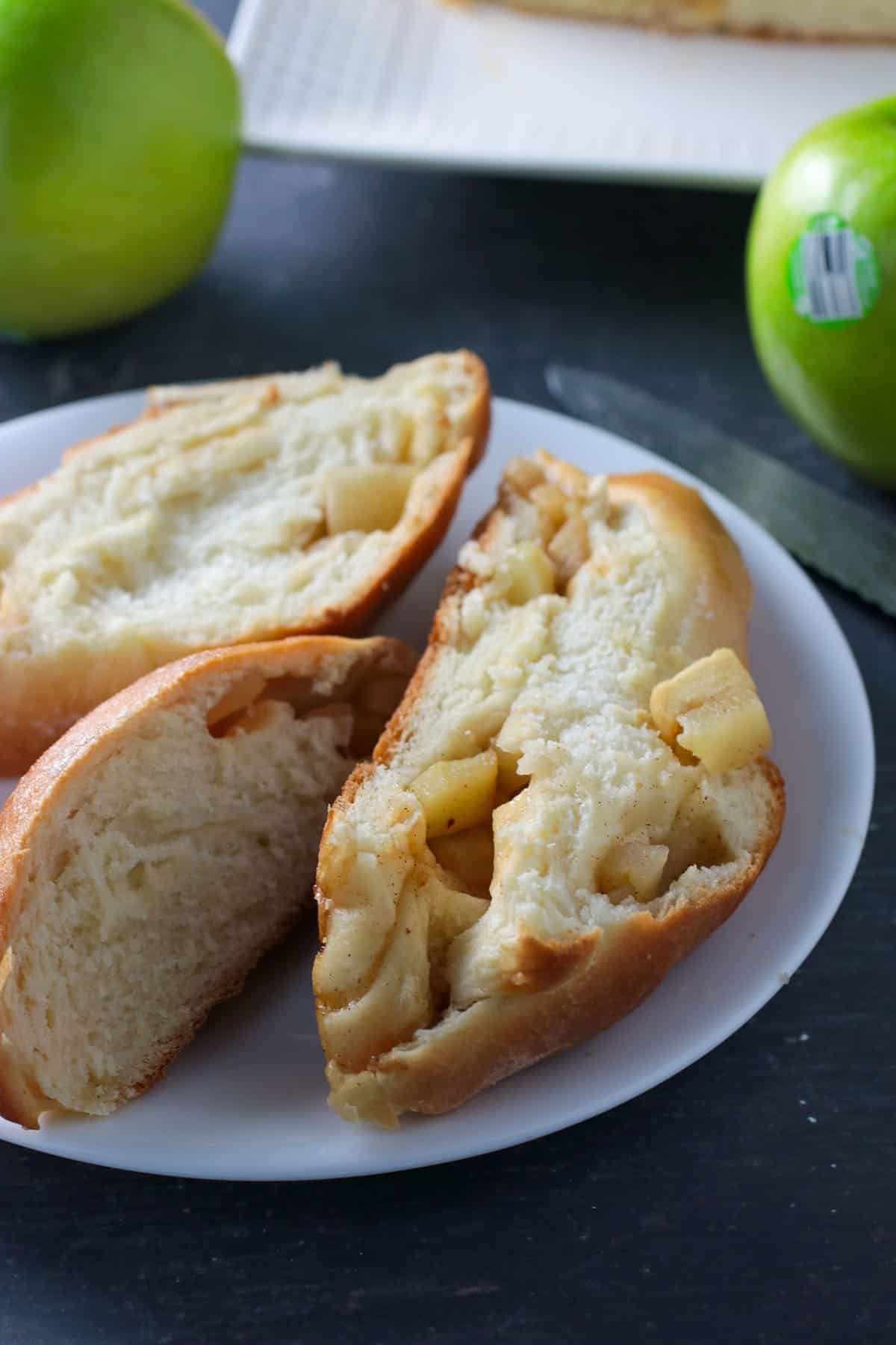   3 slices of Apple challah on a plate.