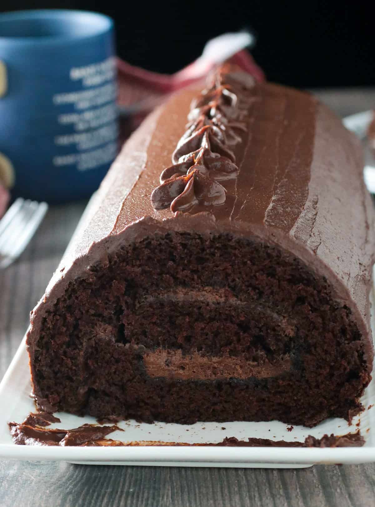 Chocolate Roll Cake on a serving plate.