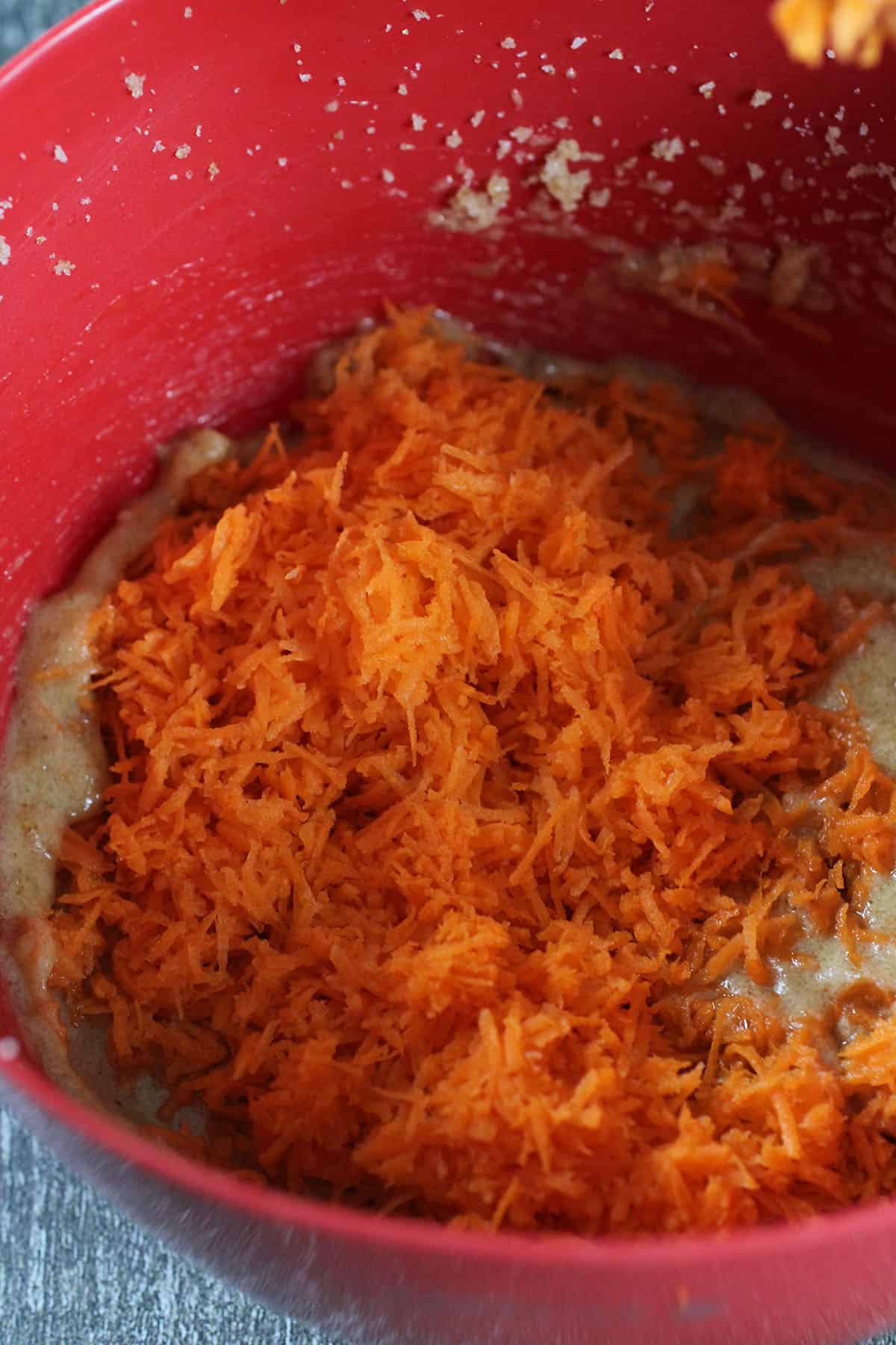 The grated carrots added to the cake batter.