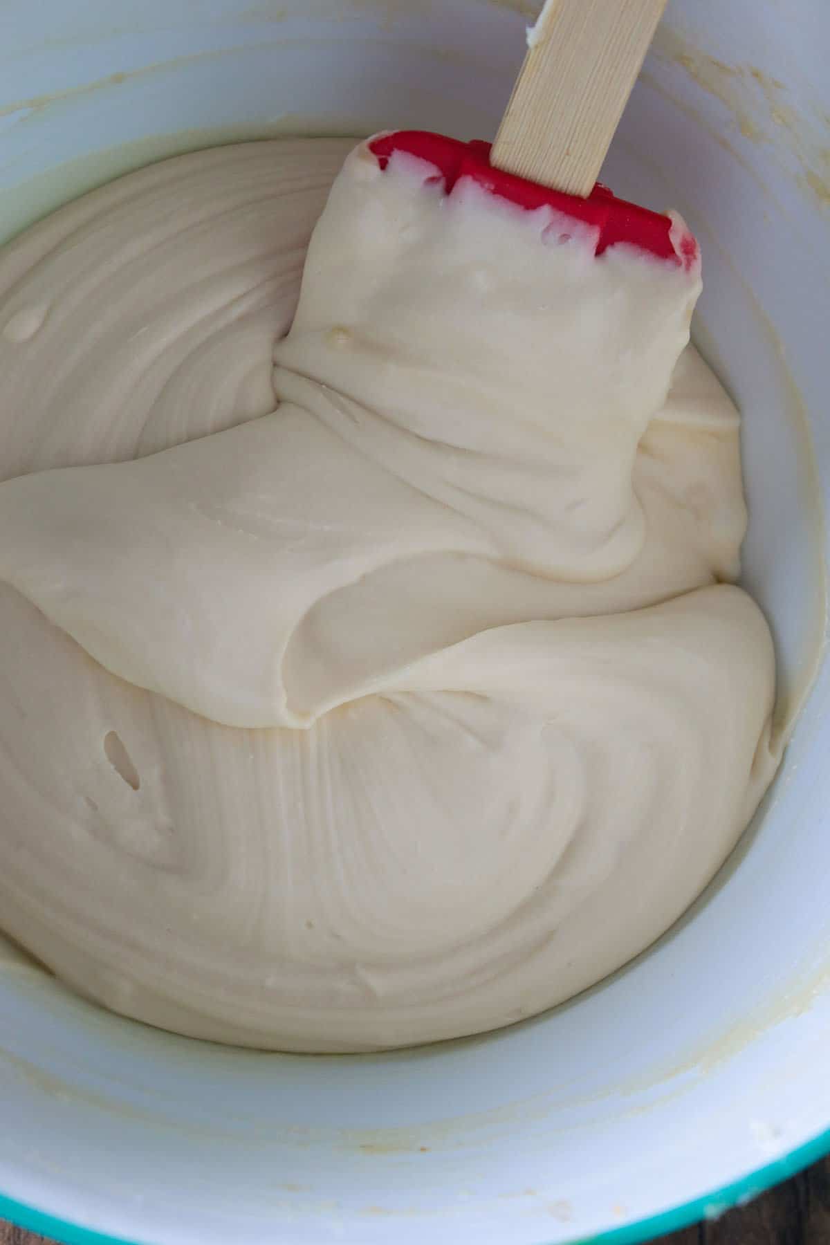 The coffee cream cheese icing in a bowl.