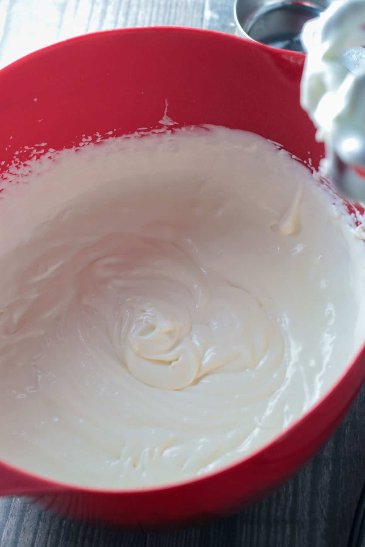 The plain cheesecake batter in a bowl.