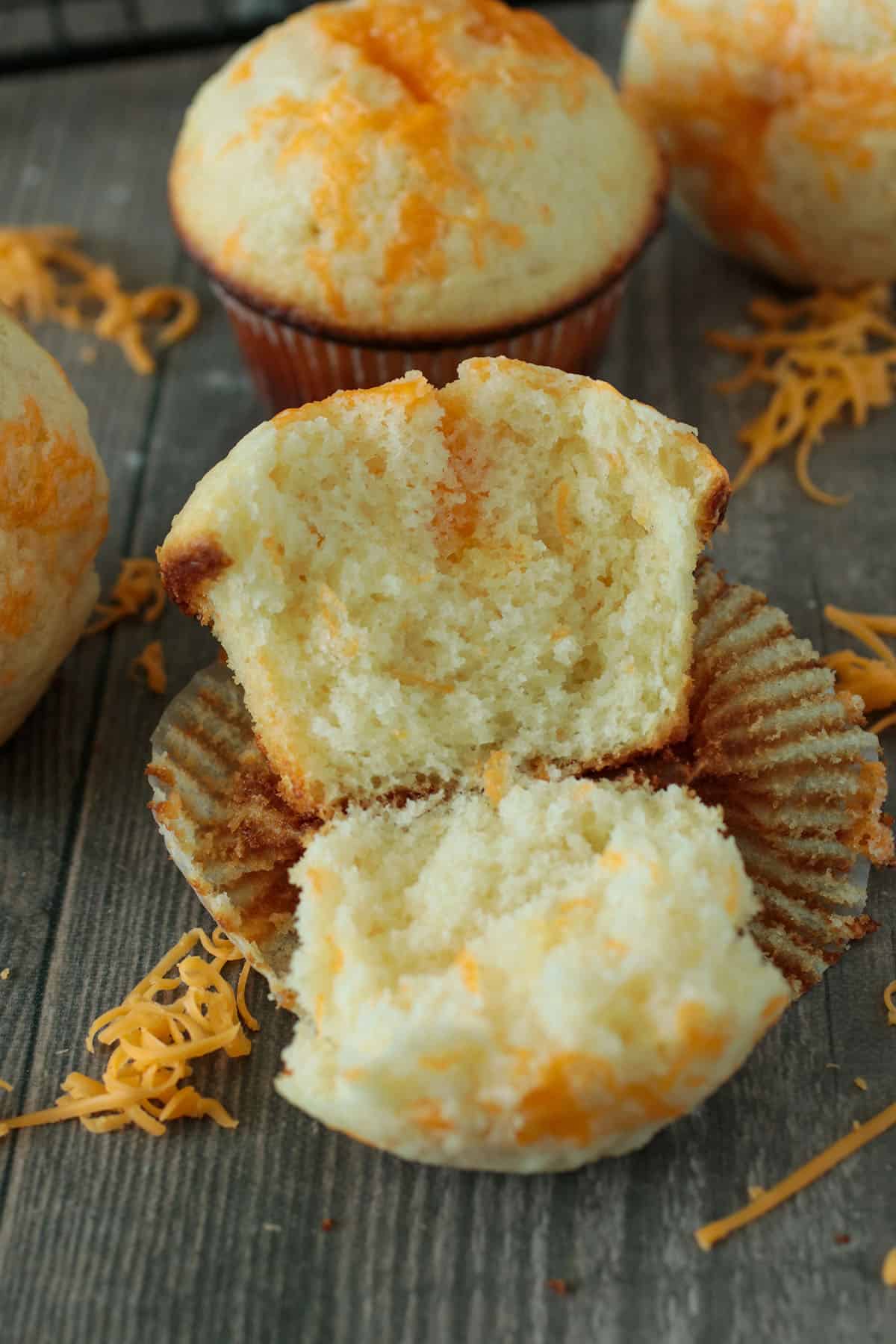 A cheese cupcake sliced in half to show the crumbs.
