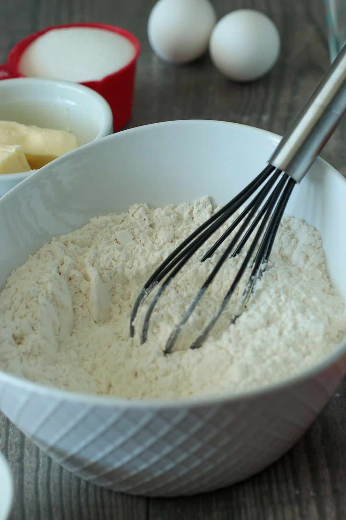 Whisking together the dry ingredients in a bowl.