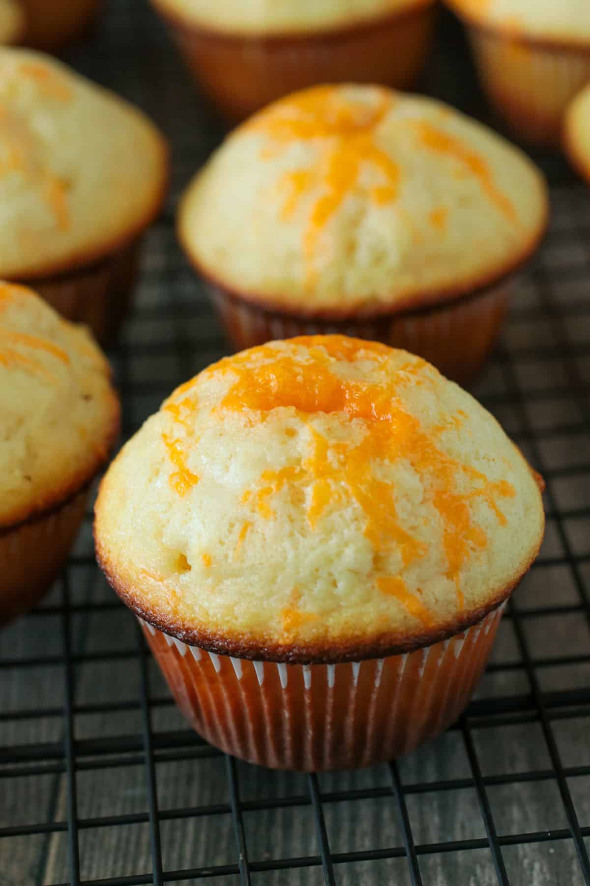 Cheese Cupcakes on a cooling rack.