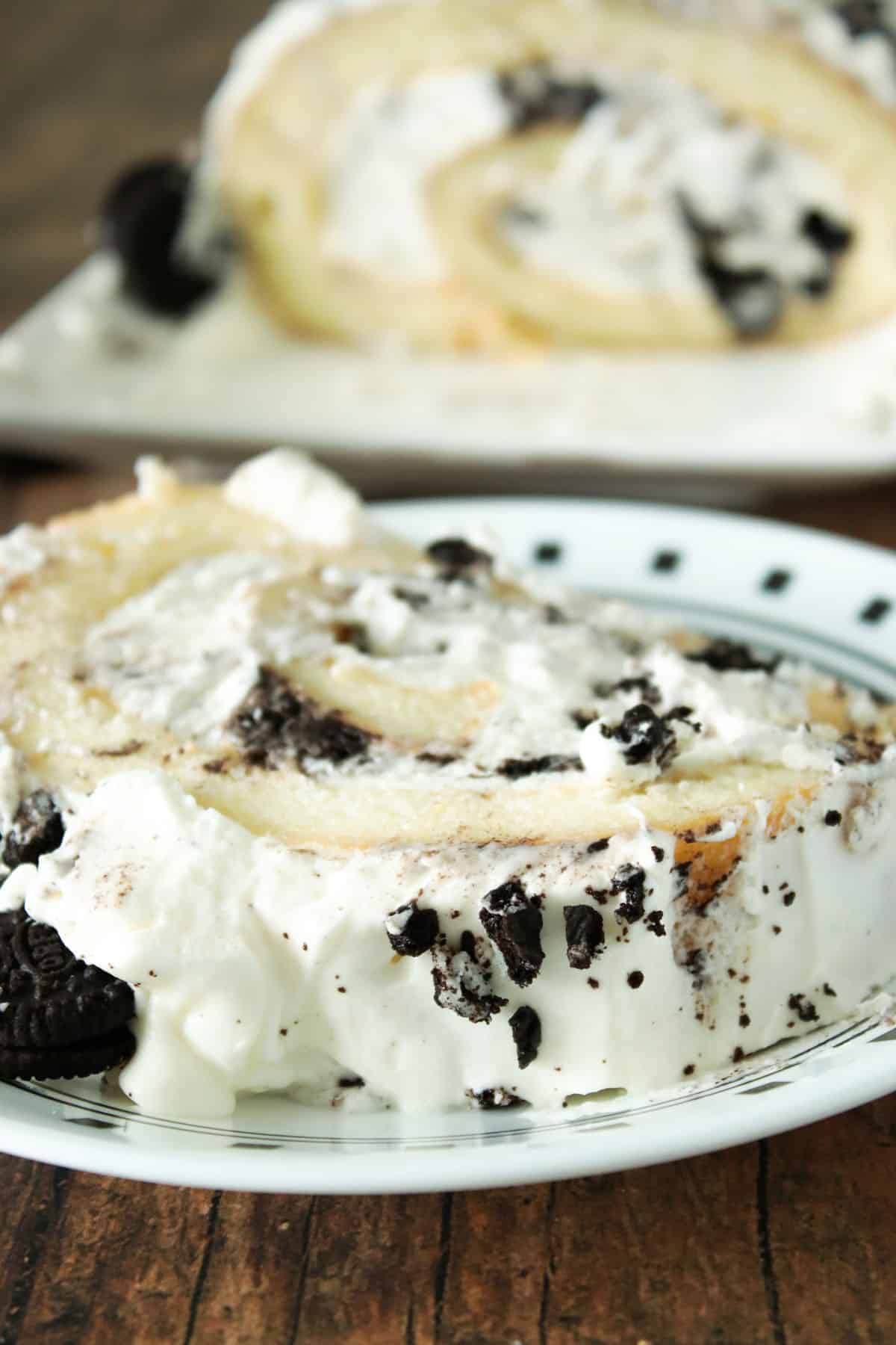 A slice of cookies and cream cake roll.