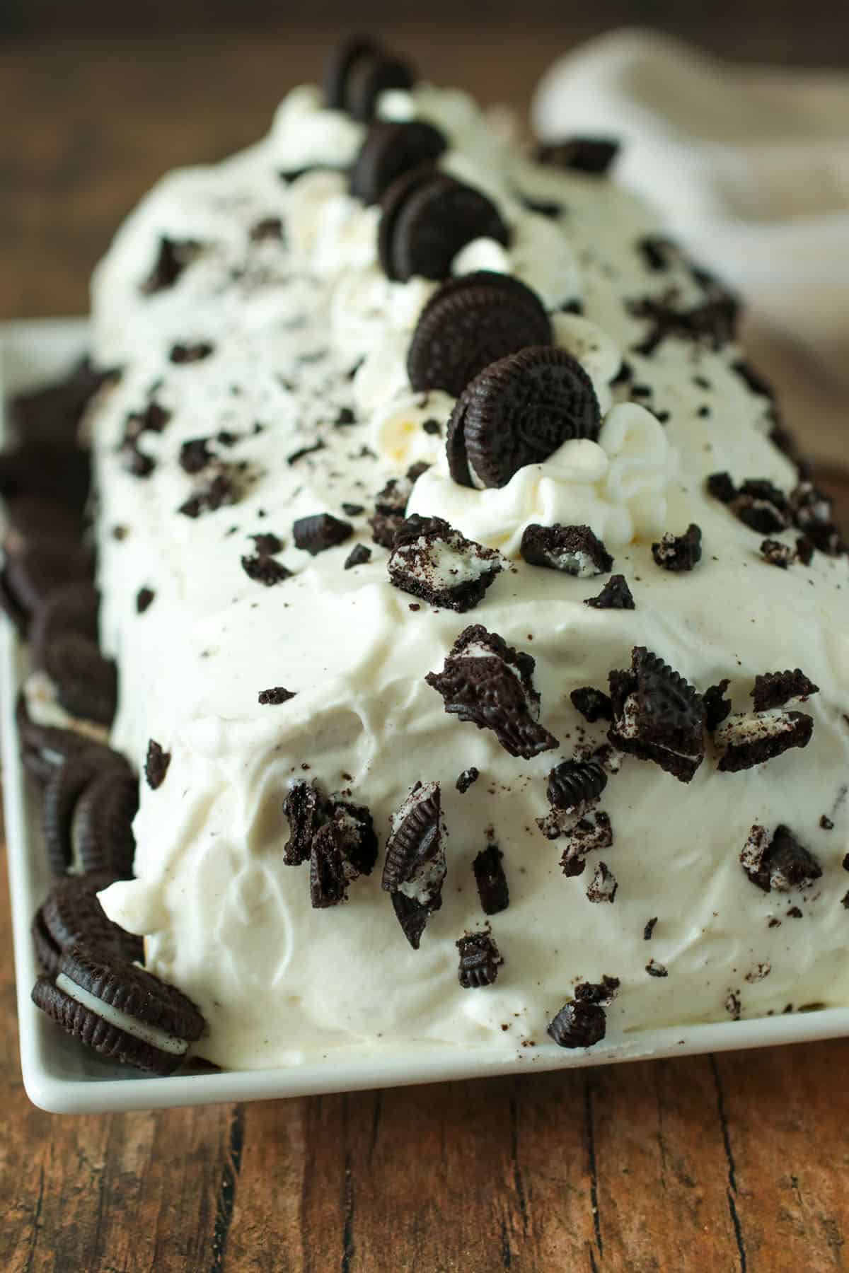 Cookies and cream cake roll in a serving platter.