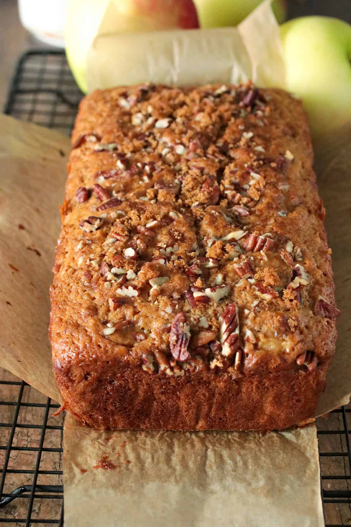 Whole Apple loaf cake on a parchment.