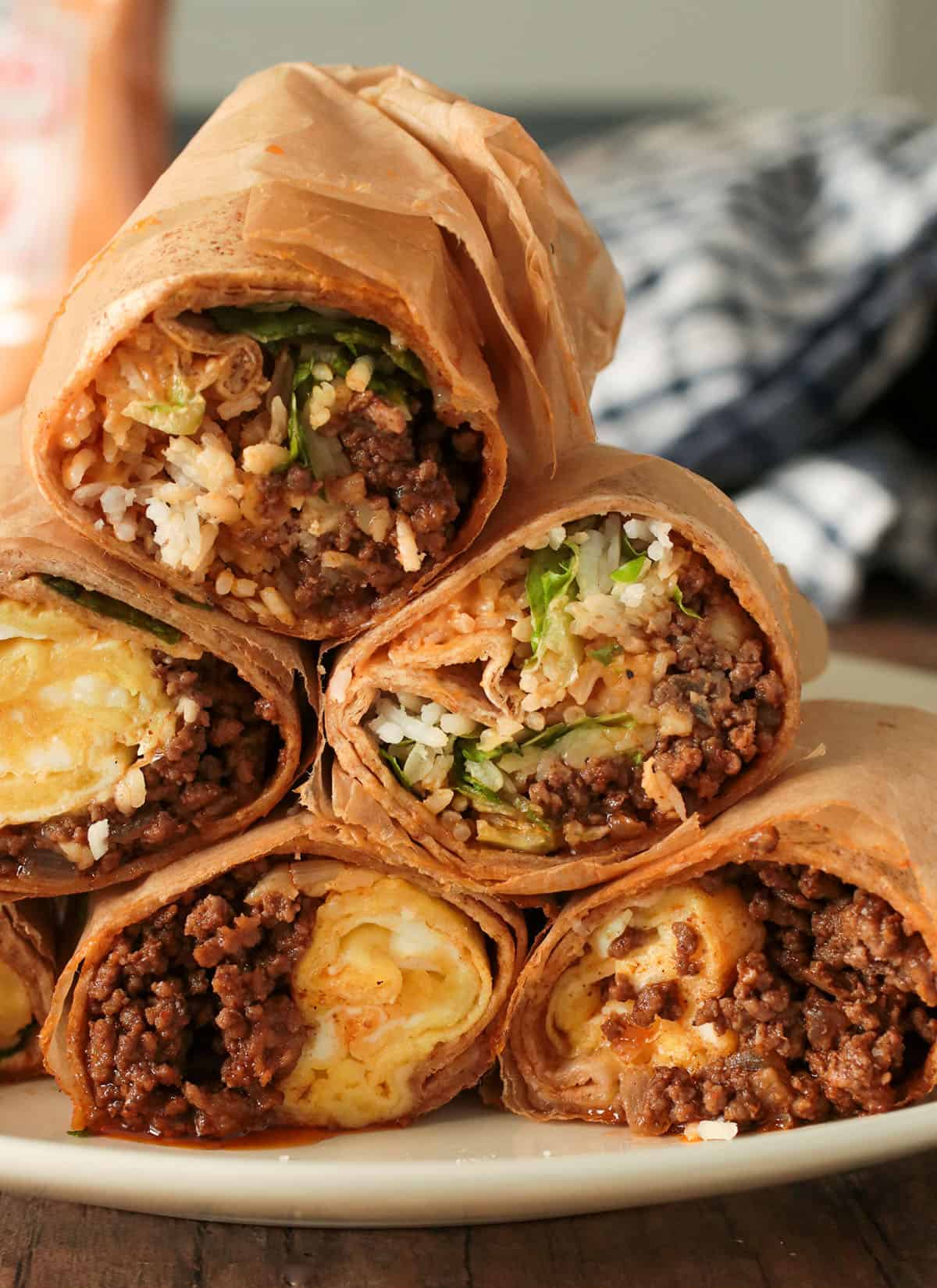 Beef burrito halves stacked together.