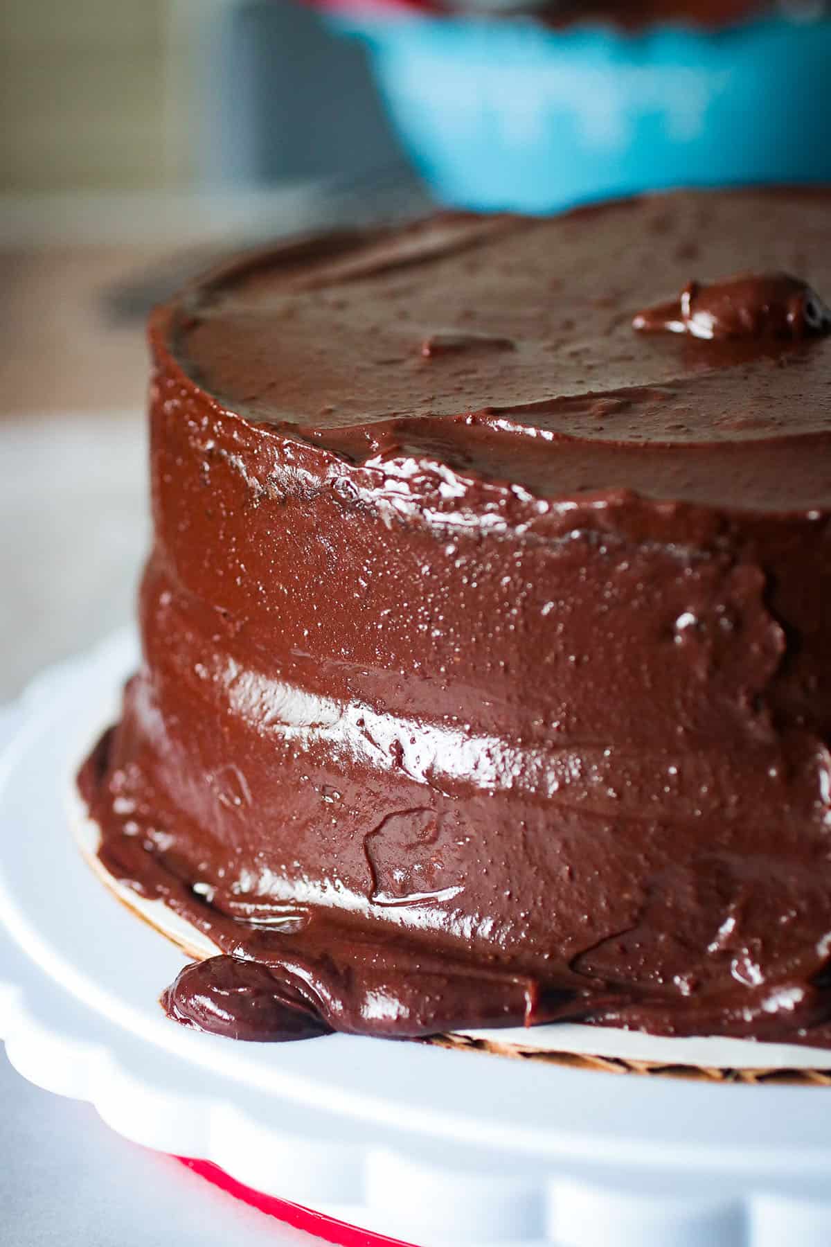 Close up of the side of a round chocolate cake.