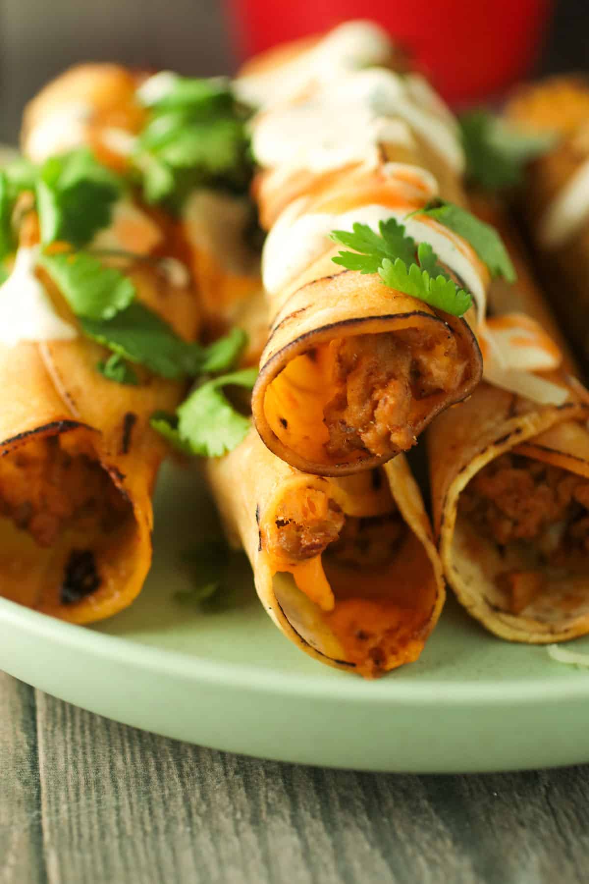 Turkey taquitos on a small plate.