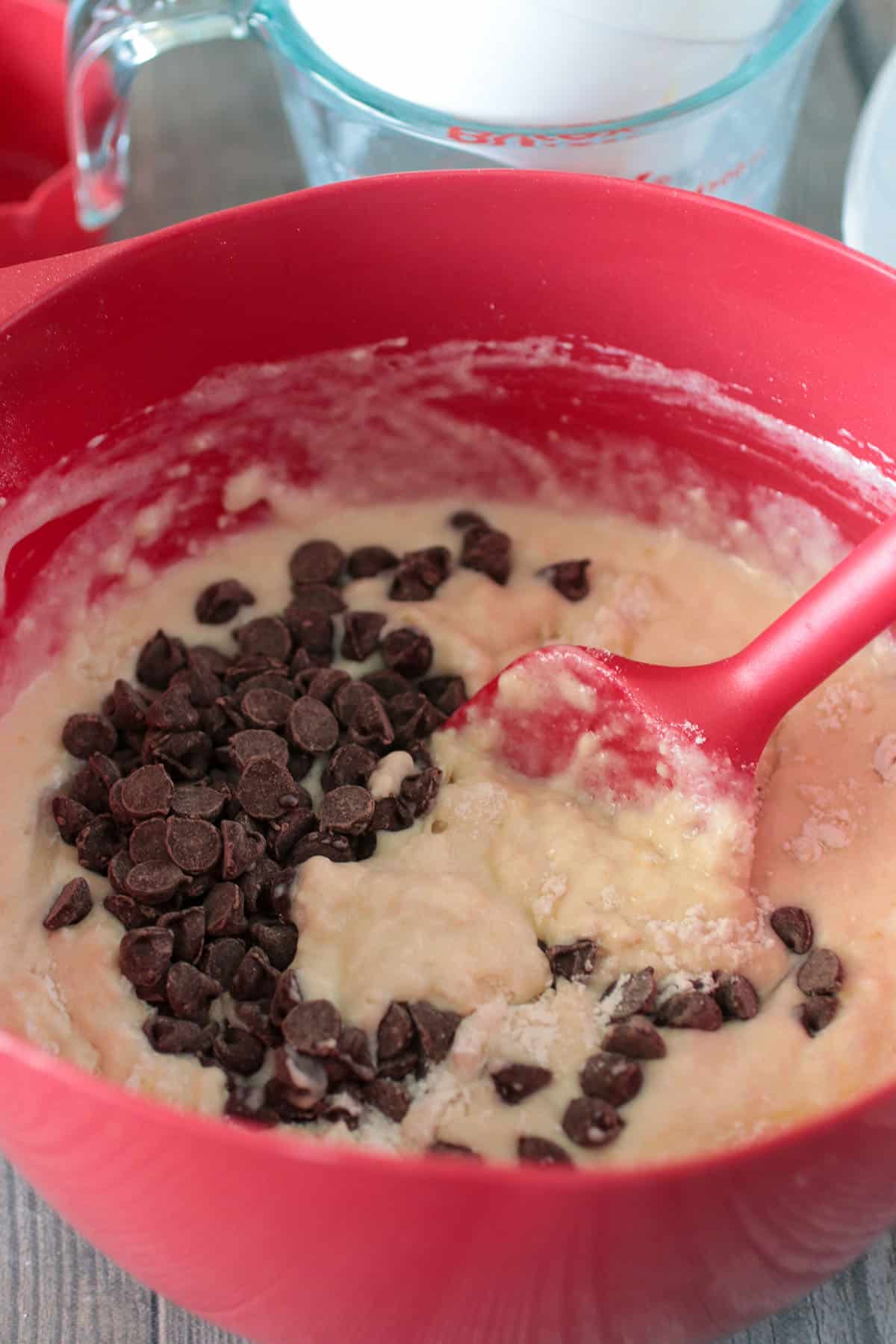 Folding the chocolate chips into the cake batter.