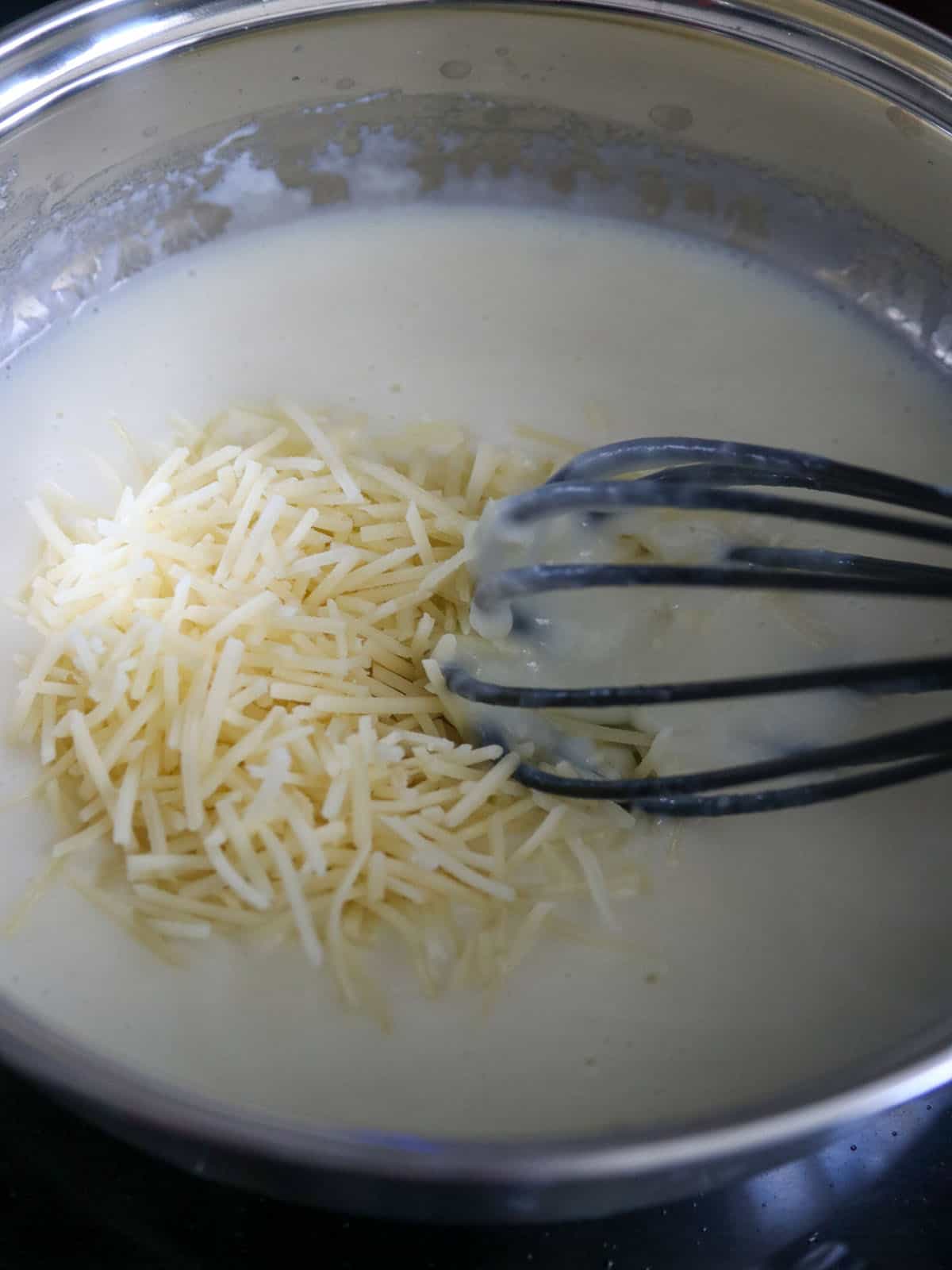 Making the white pizza sauce.