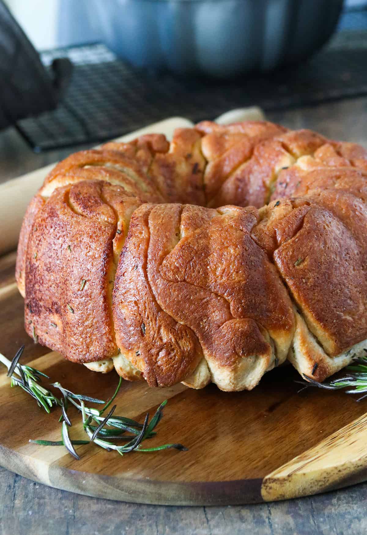 The whole Rosemary Garlic Pull Apart Bread on a cutting board.