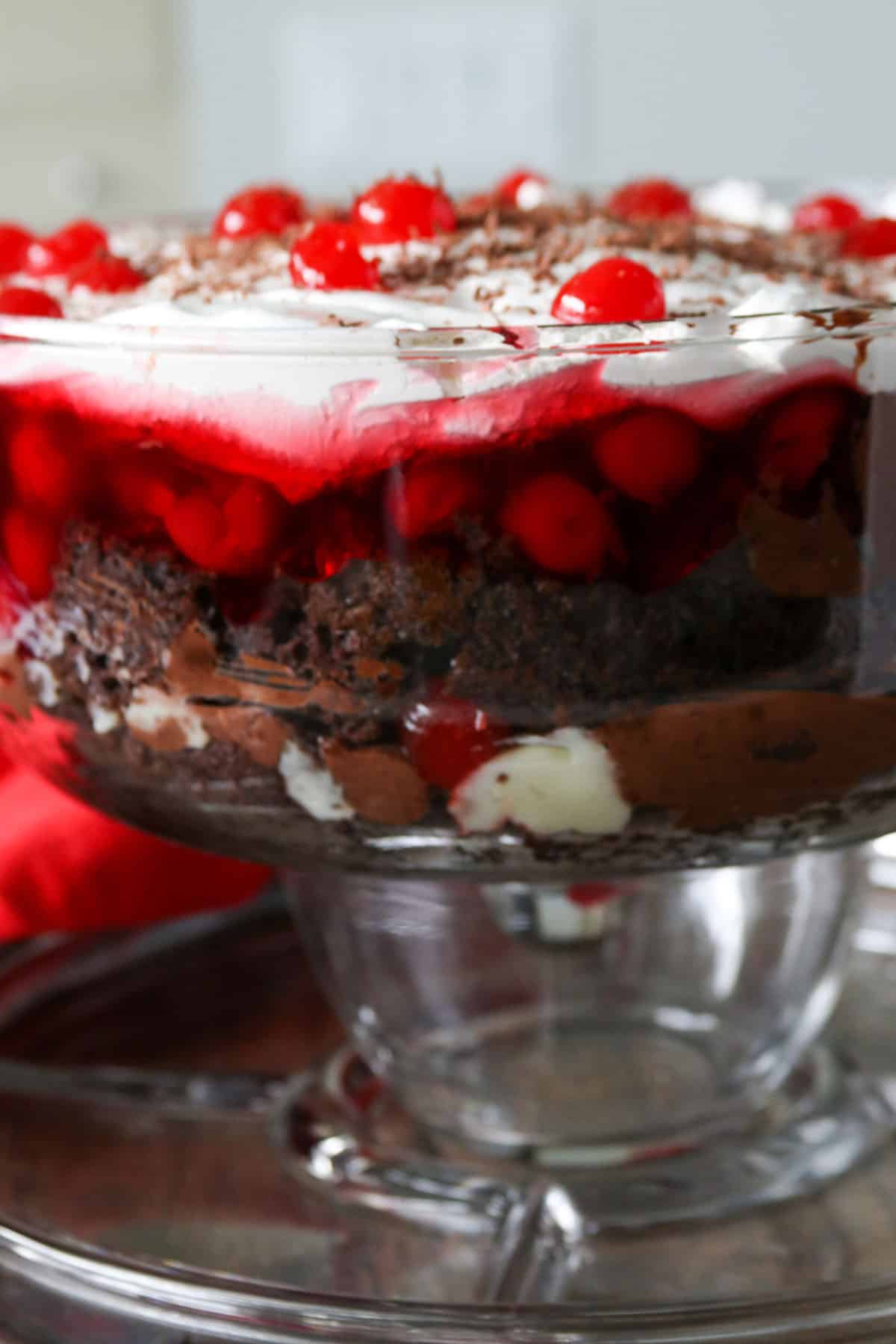 Black forest trifle dessert on a cake bowl.
