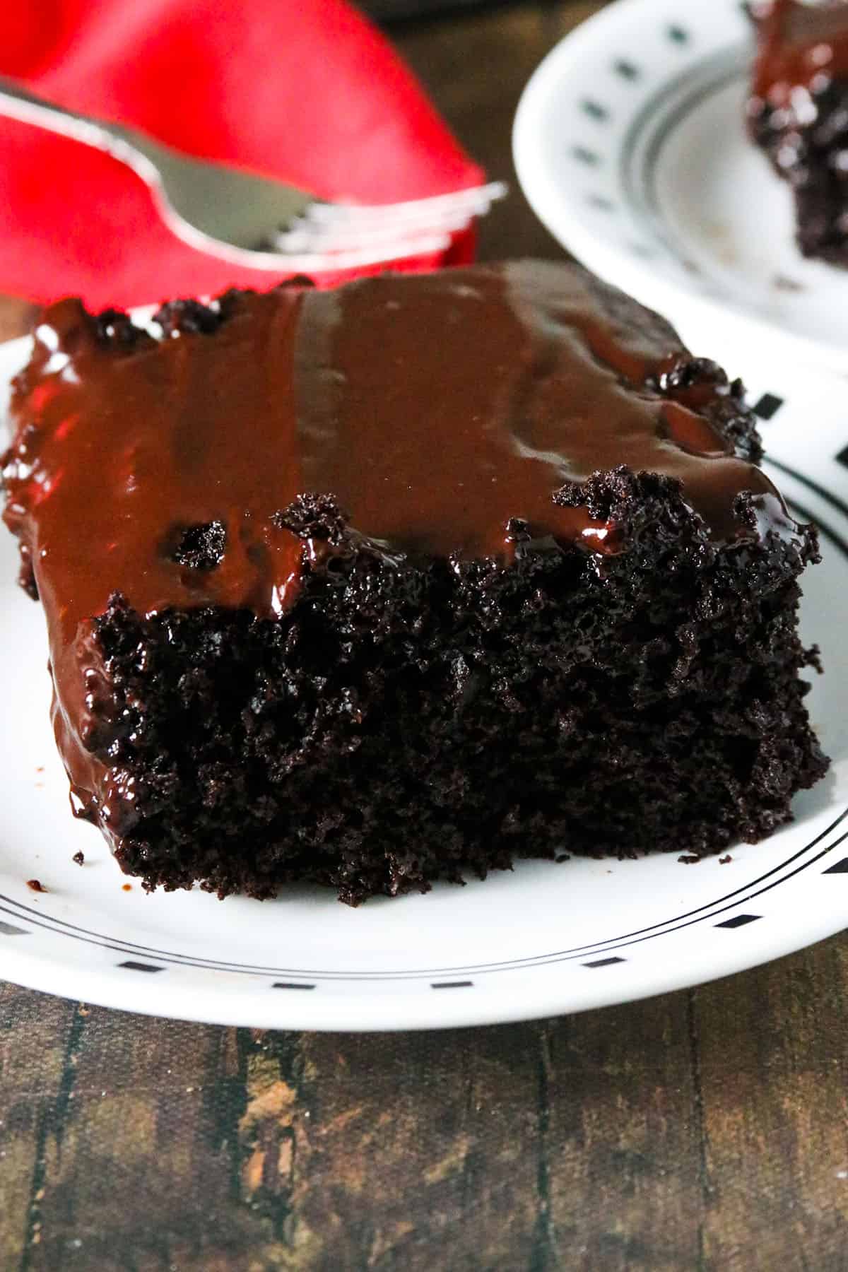 A slice of Devil's Food Sheet cake on a plate.