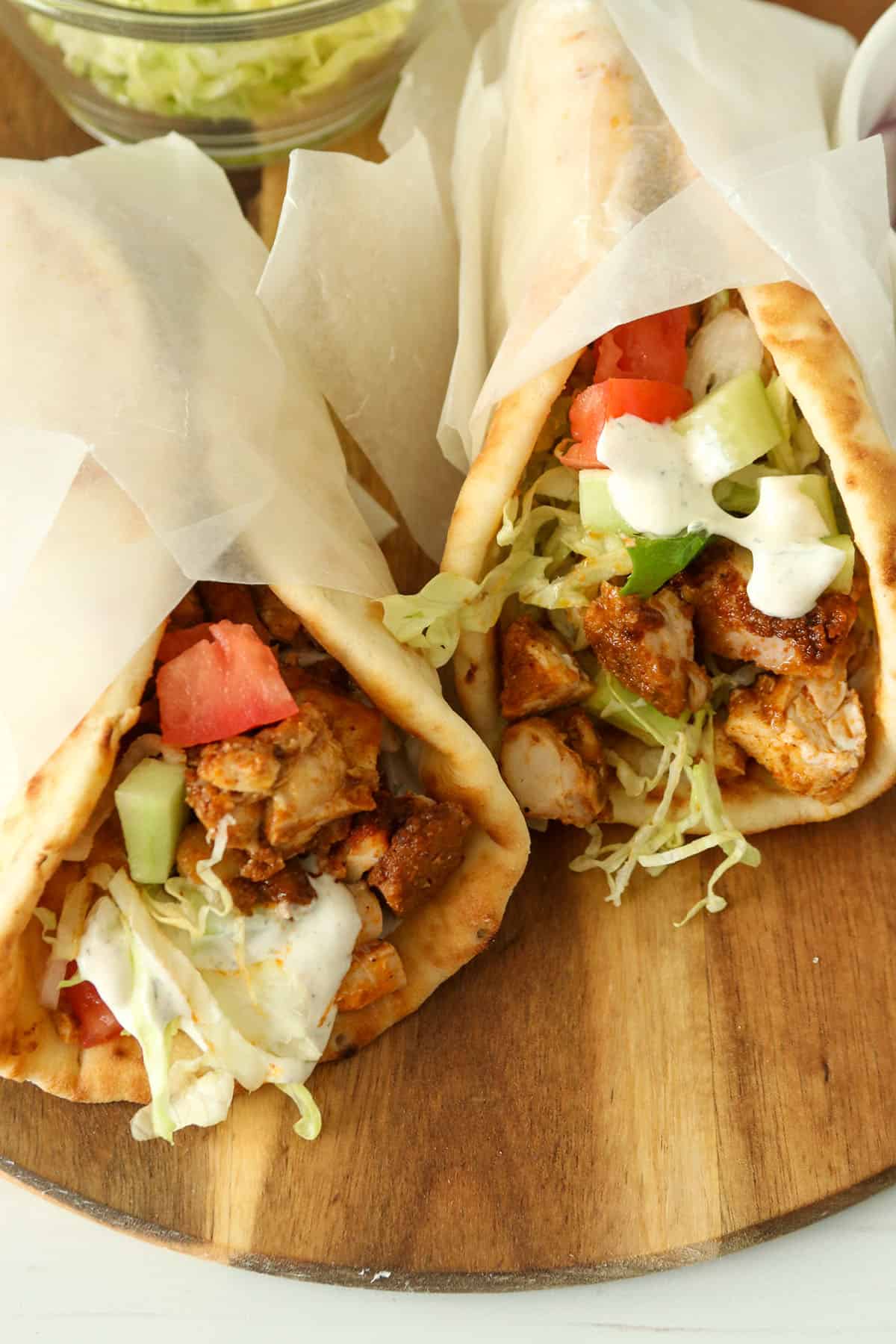 Two wrapped baked shawarma.