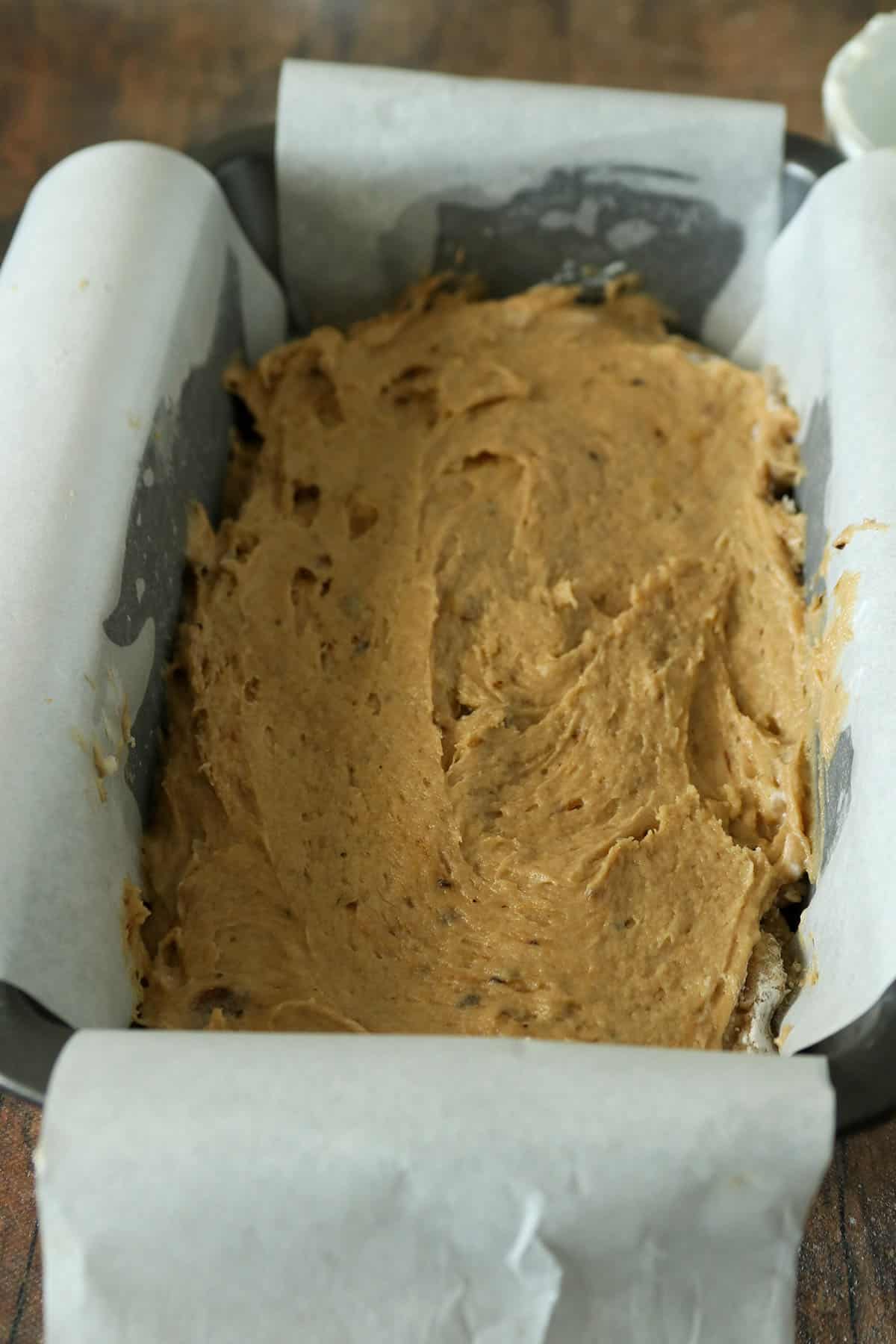 The Coffee Cake Banana bread batter in a loaf pan.