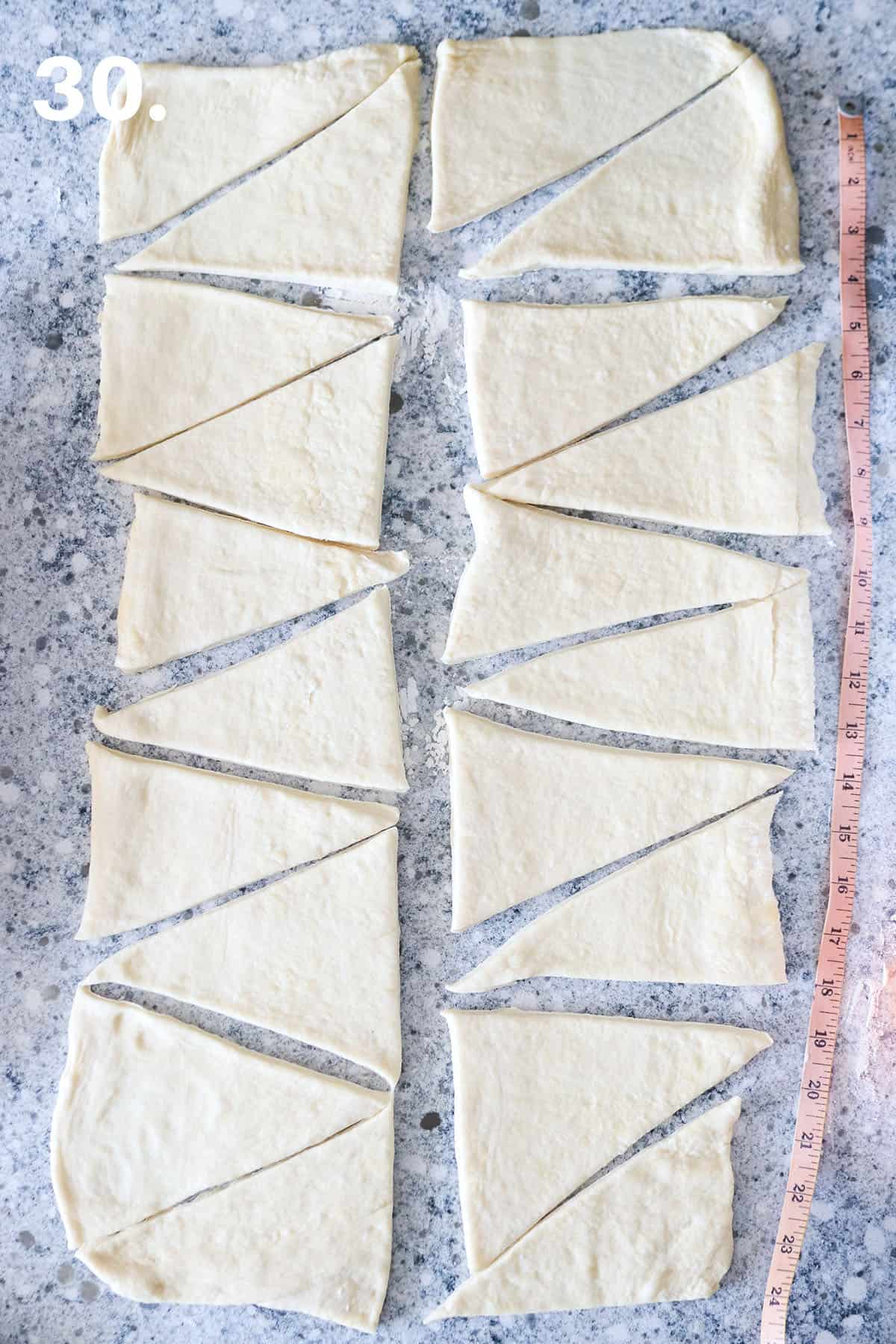 Triangles are cut from the dough.