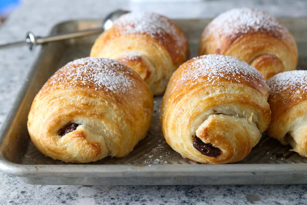 Chocolate Croissants in a baking sheet.