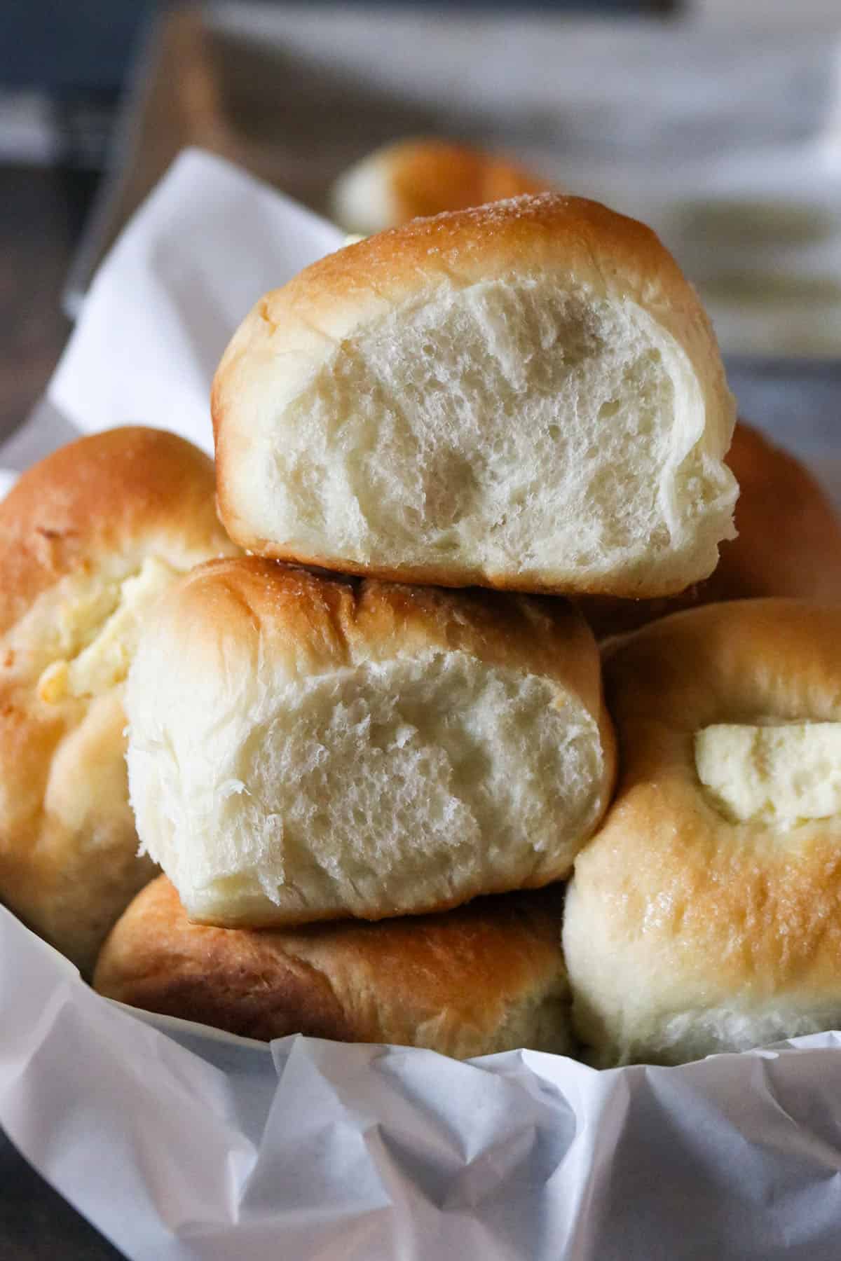 Cream cheese bread rolls stacked together.