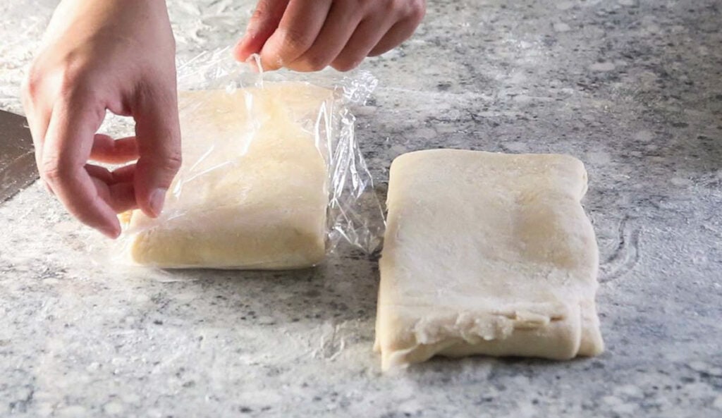 Cutting the Danish pastry in two.