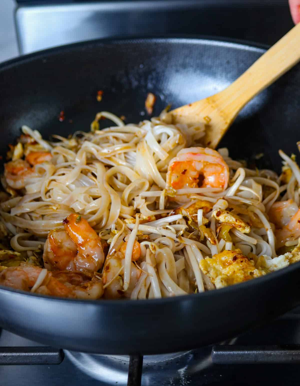 Cooking the Pad Thai in a wok.