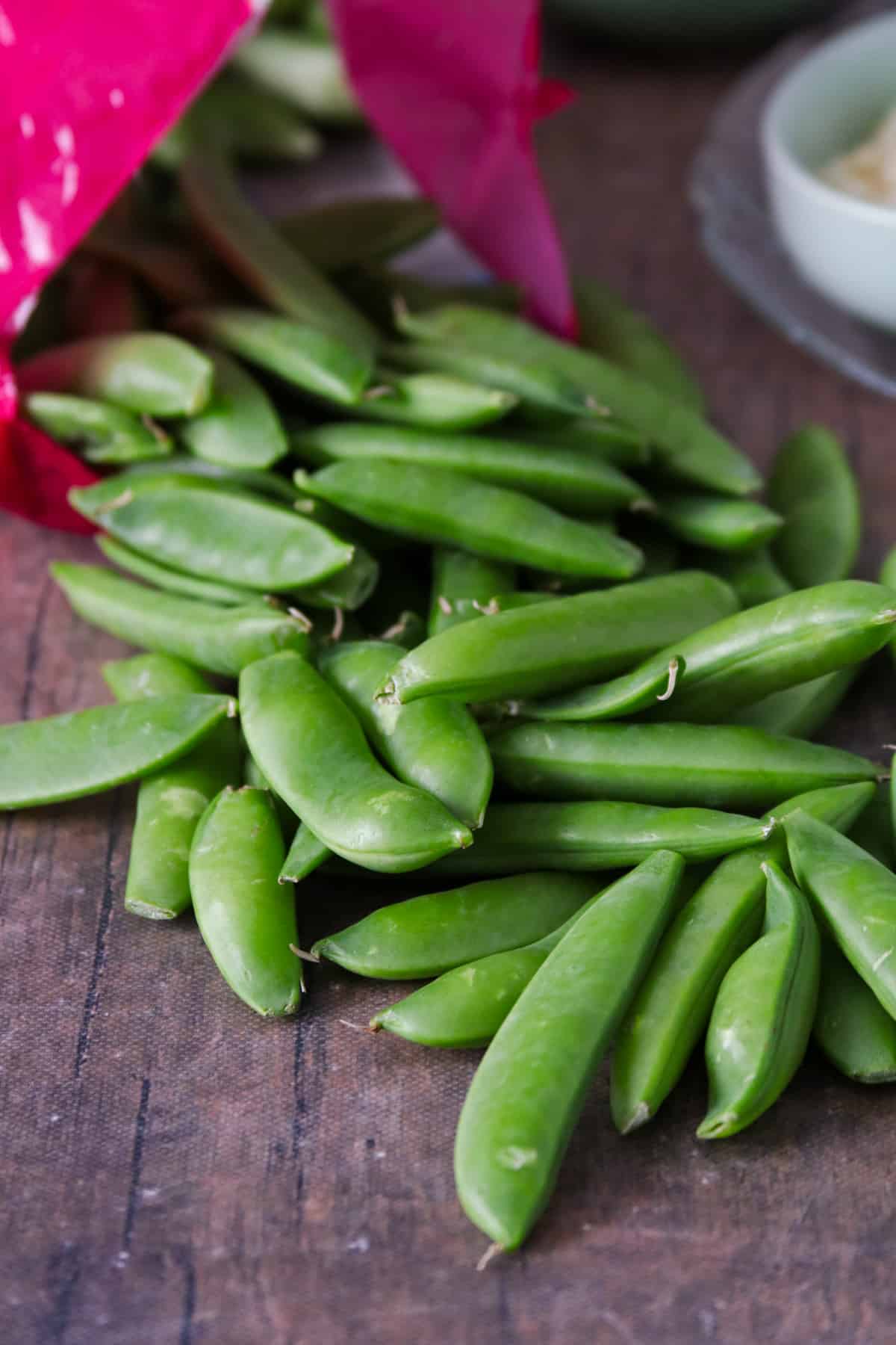 Sugar Snap peas out of a bag.