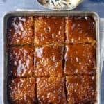 A pan of Biko sliced cut into squares in the pan.
