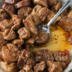 Pork binagoongan in a shallow dish.