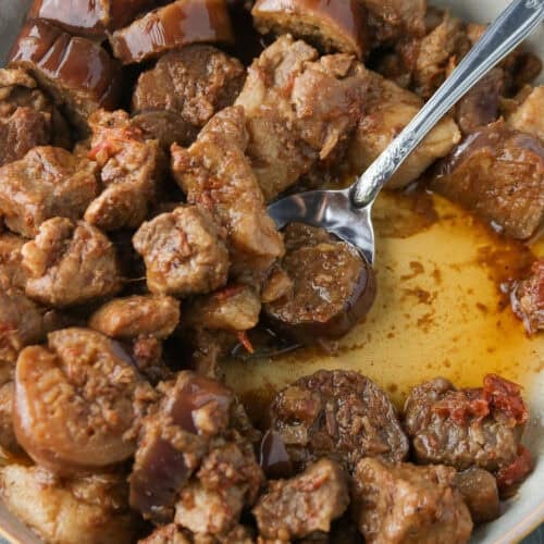 Pork binagoongan in a shallow dish.