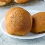 3 coffee buns on a white plate.