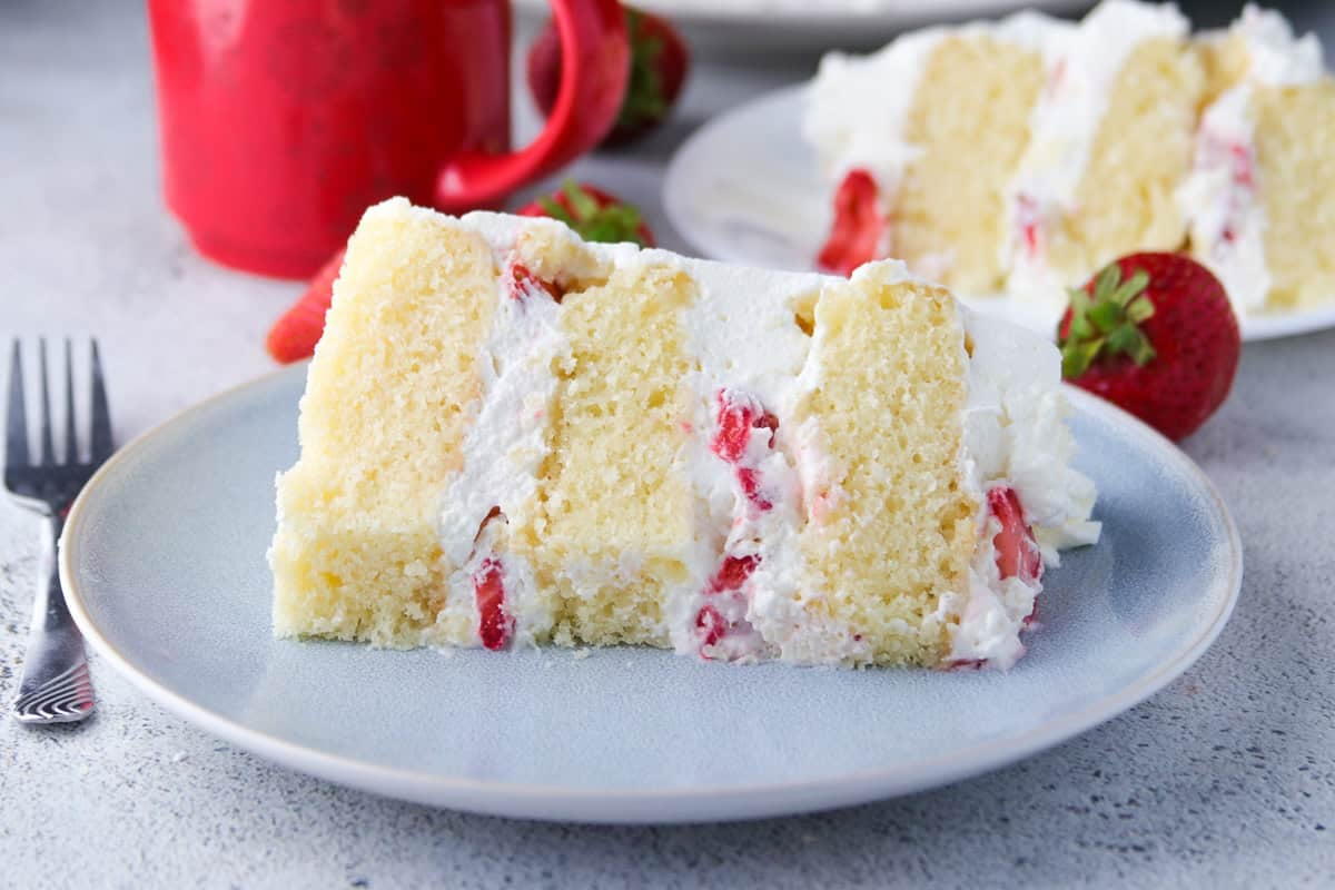 A slice of strawberry shortcake on a plate.
